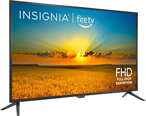 Insignia Fire TV displaying a sunset over a field, labeled FHD Full High Definition.