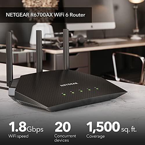 Netgear R6700AX WiFi 6 router on desk with features listed, including 1.8 Gbps speed, 20 devices support, and 1,500 sq. ft. coverage.